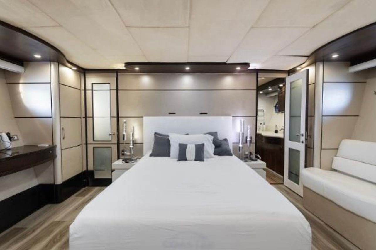 Bedroom with Big Bed and Flat Screen TV inside 110 Ft Rodman Luxury Yacht